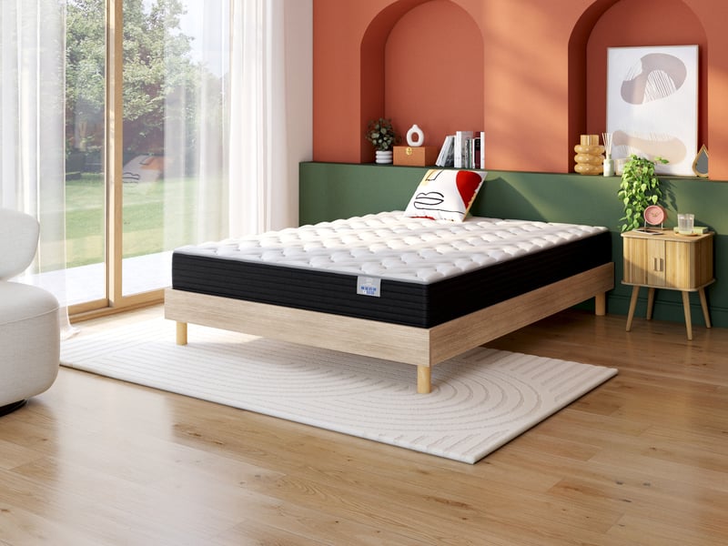 Matelas Confobed Illico sur un cadre en bois dans une chambre
