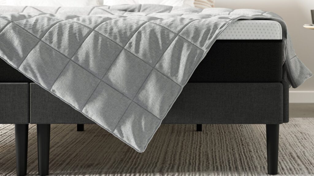Gros plan sur les poches matelassées de la Couverture Lestée Emma