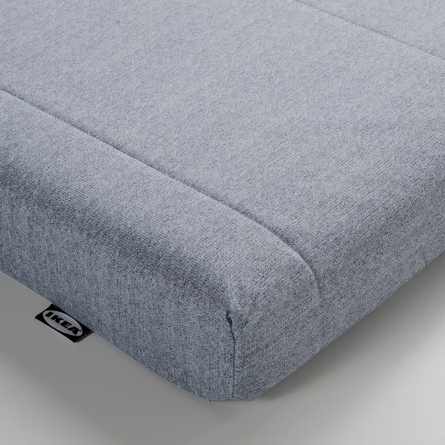 Matelas IKEA ÅGOTNES, gros plan sur l'angle et le tissu gris bleu