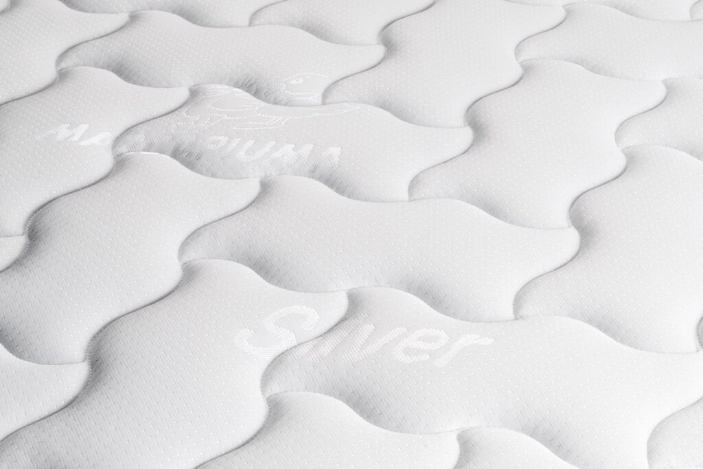 Gros plan du tissu matelassé du Marcapiuma Rainbow Plus