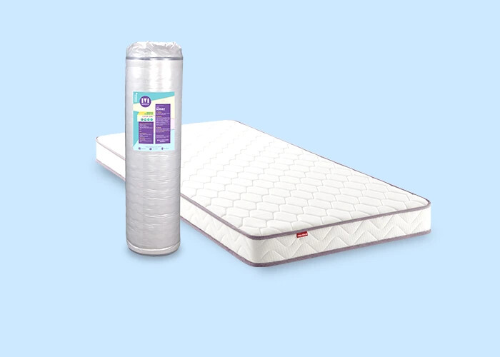 Matelas Mérinos Positive Lit à côté de son emballage roulé