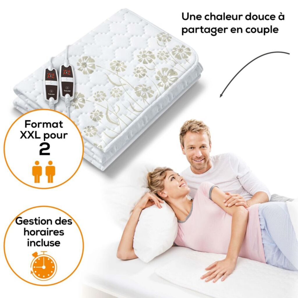 Couple sur un lit avec le Beurer UB 68 XXL, format deux places