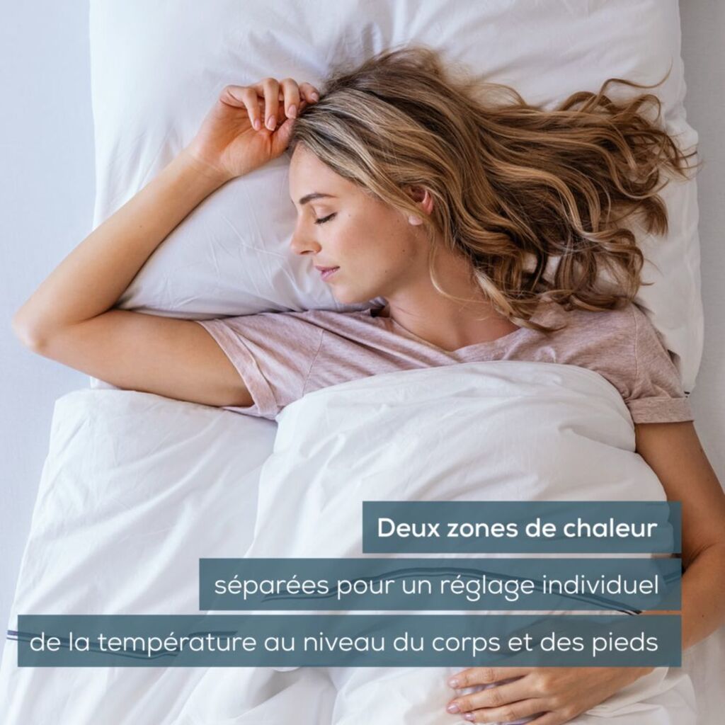 Femme endormie sur le Beurer UB 90, mention des deux zones de chaleur corps et pieds