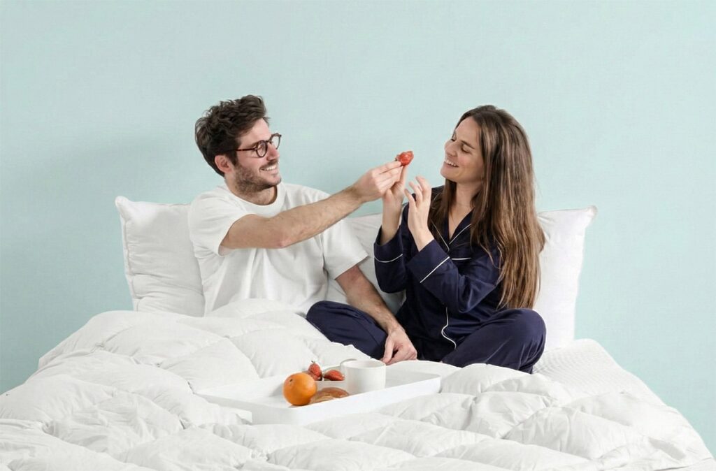 Couple au lit avec des oreillers Nyte Duvy