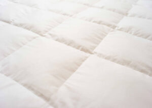 Surmatelas Kipli en plumes et duvet
